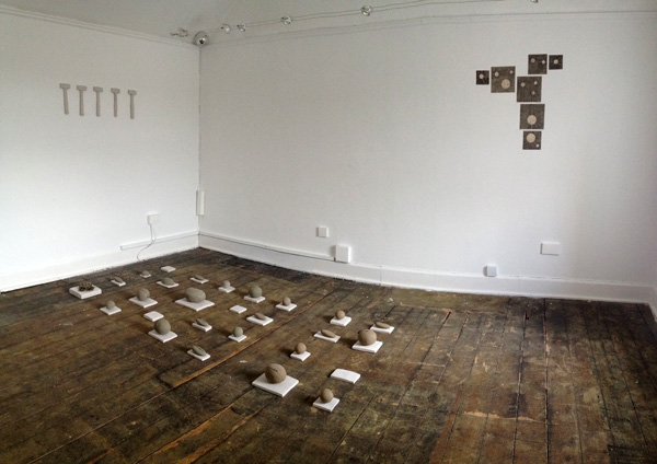 How to make a river speak? Exhibition view Caroline Inckle 2013 Cast stones in natural clay, chalk plinths and chalk hammers.